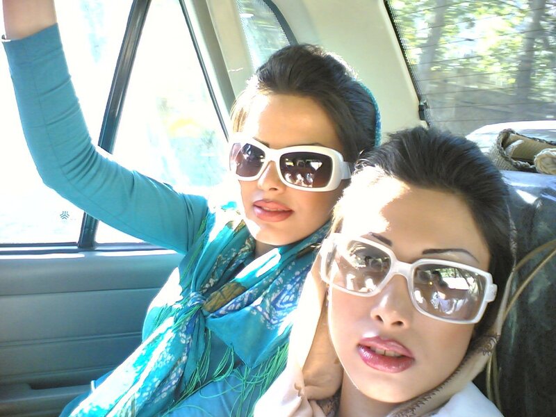 Two women in car with sunglasses