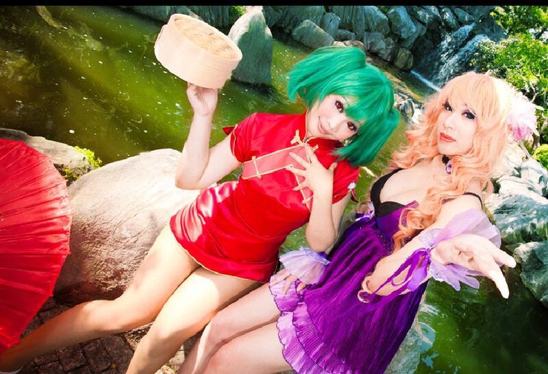 Two Women in Costumes — Green, Playful, Afternoon