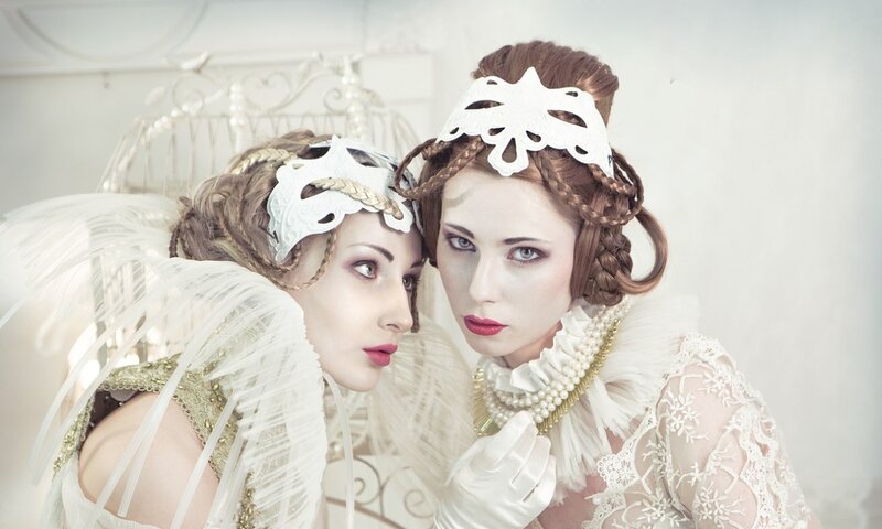 Two Women in Costumes — White, Dramatic