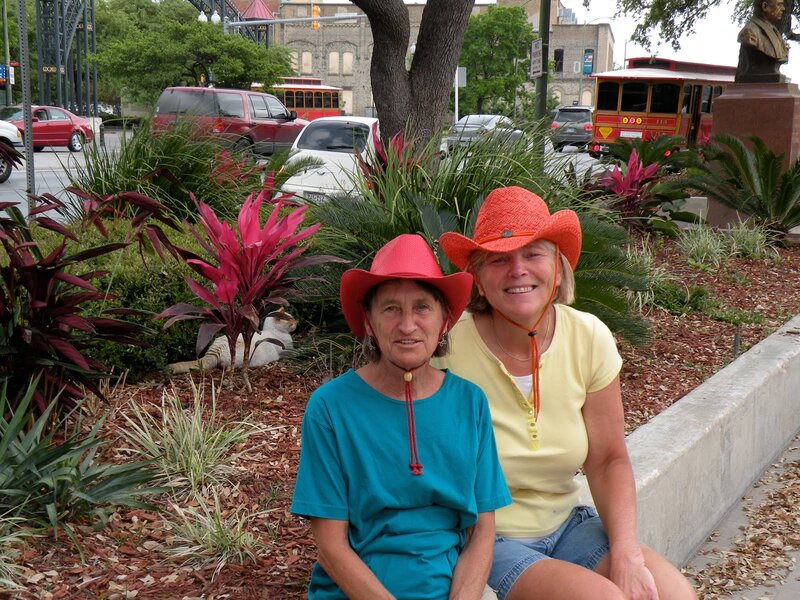 Two Women in Cowboy Hats — Red