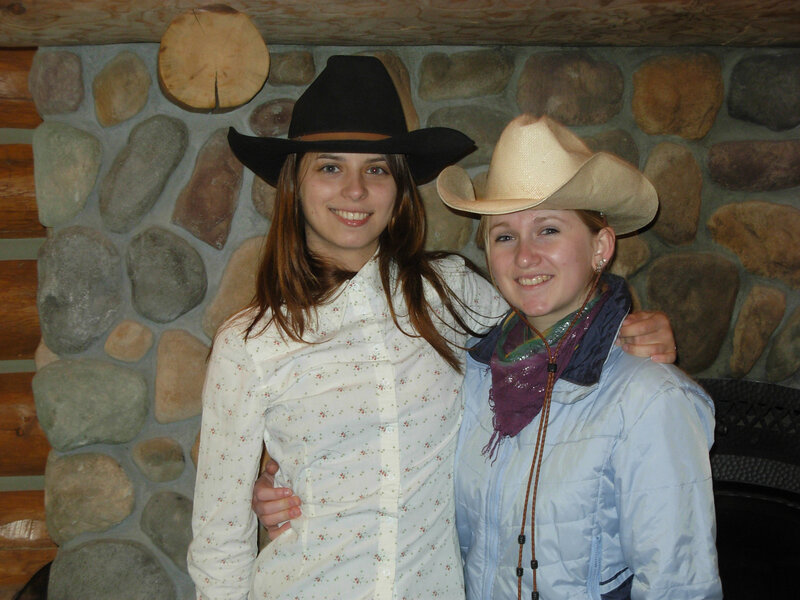 Two Women in Cowboy Hats — White, Friendly