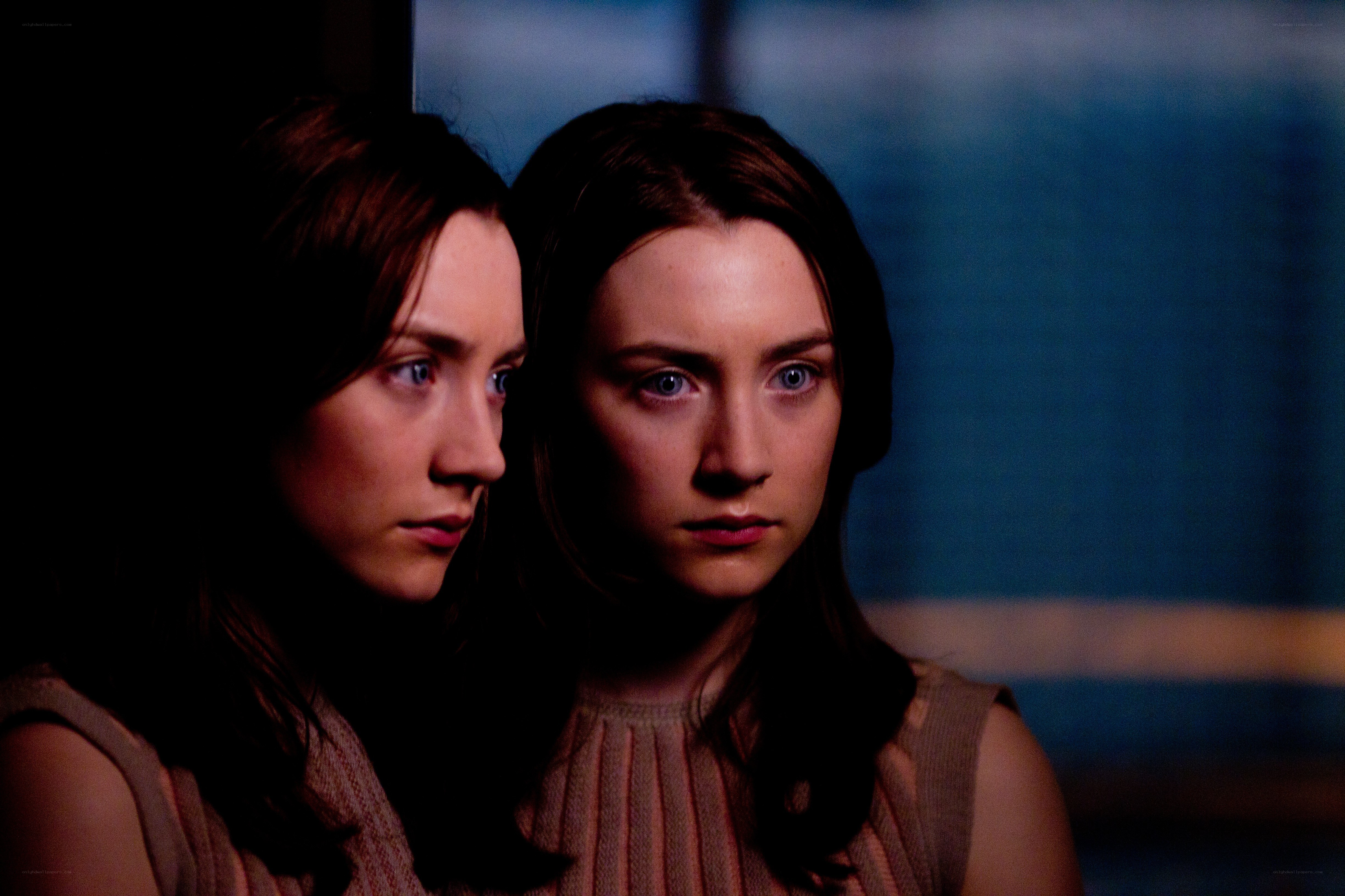 two women in dim light