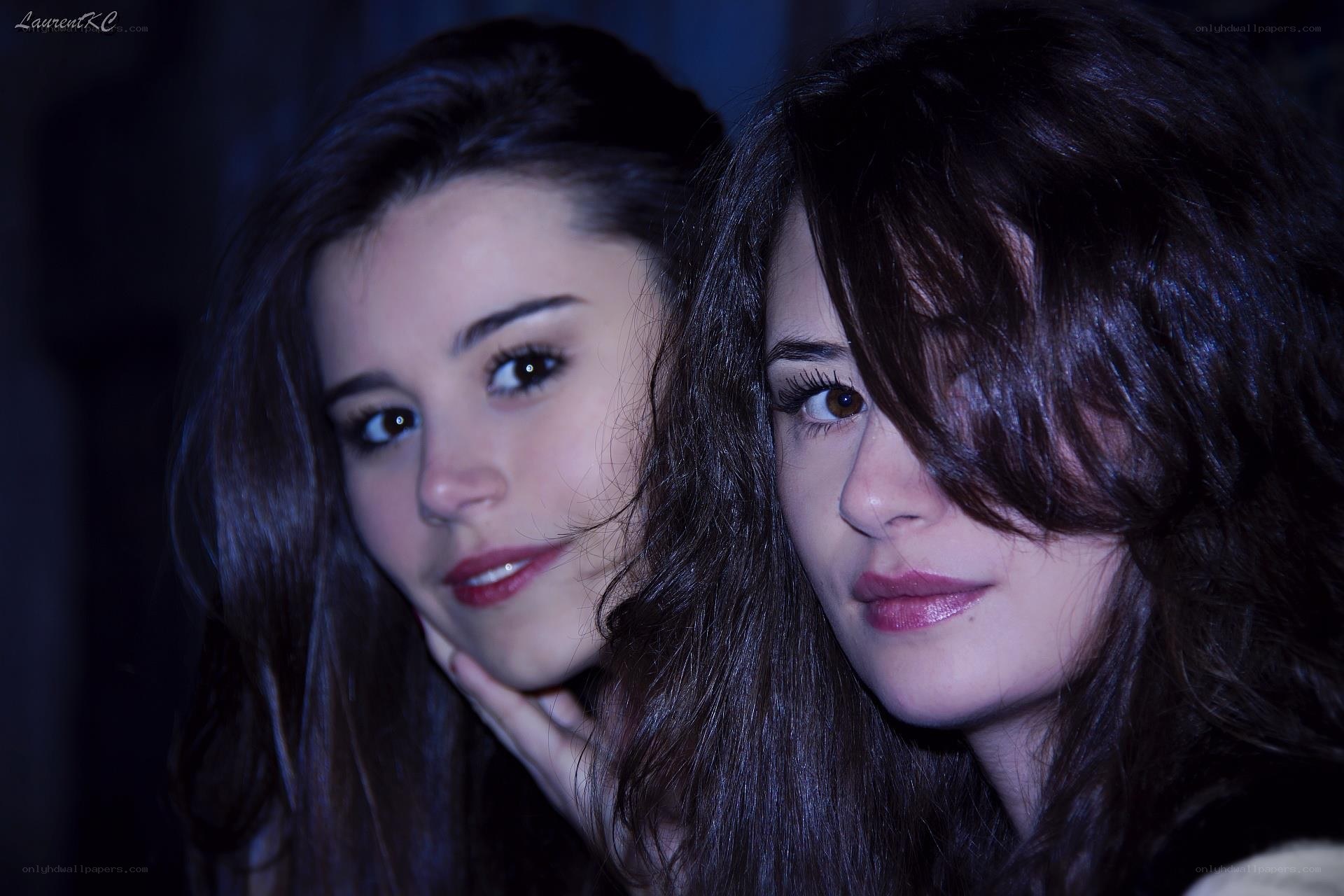 two women in dim light
