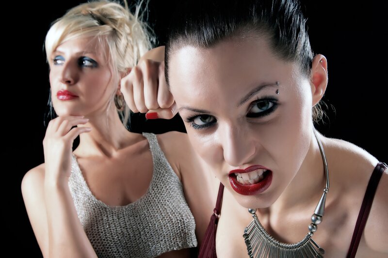 Two women in dramatic poses