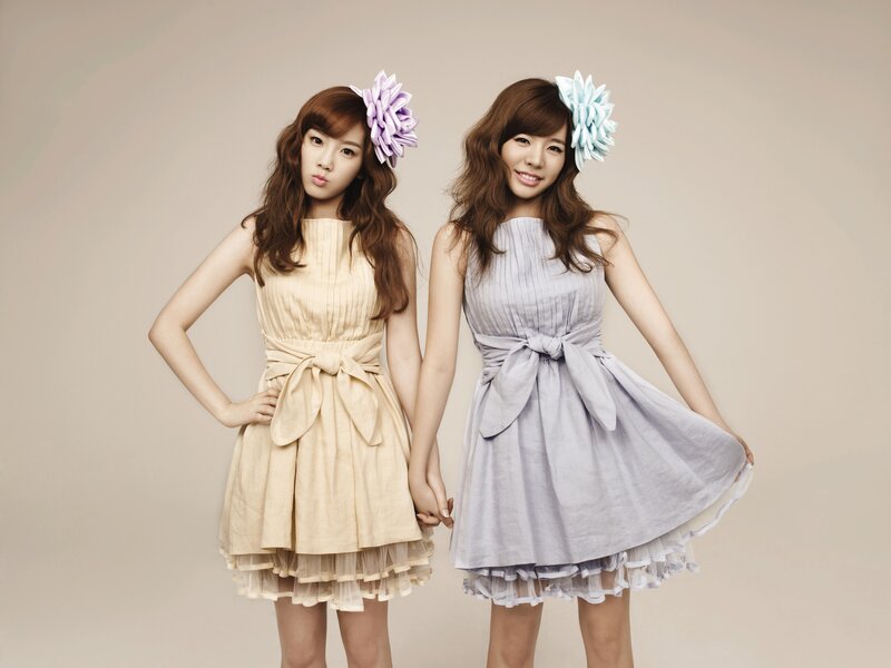 Two women in dresses with flowers