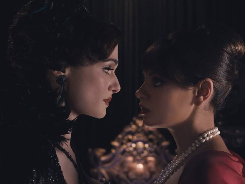 Two women in elegant attire