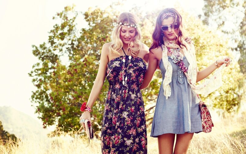 Two women in floral dresses