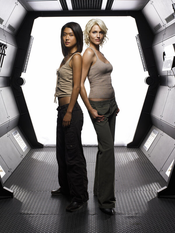 two women in futuristic corridor