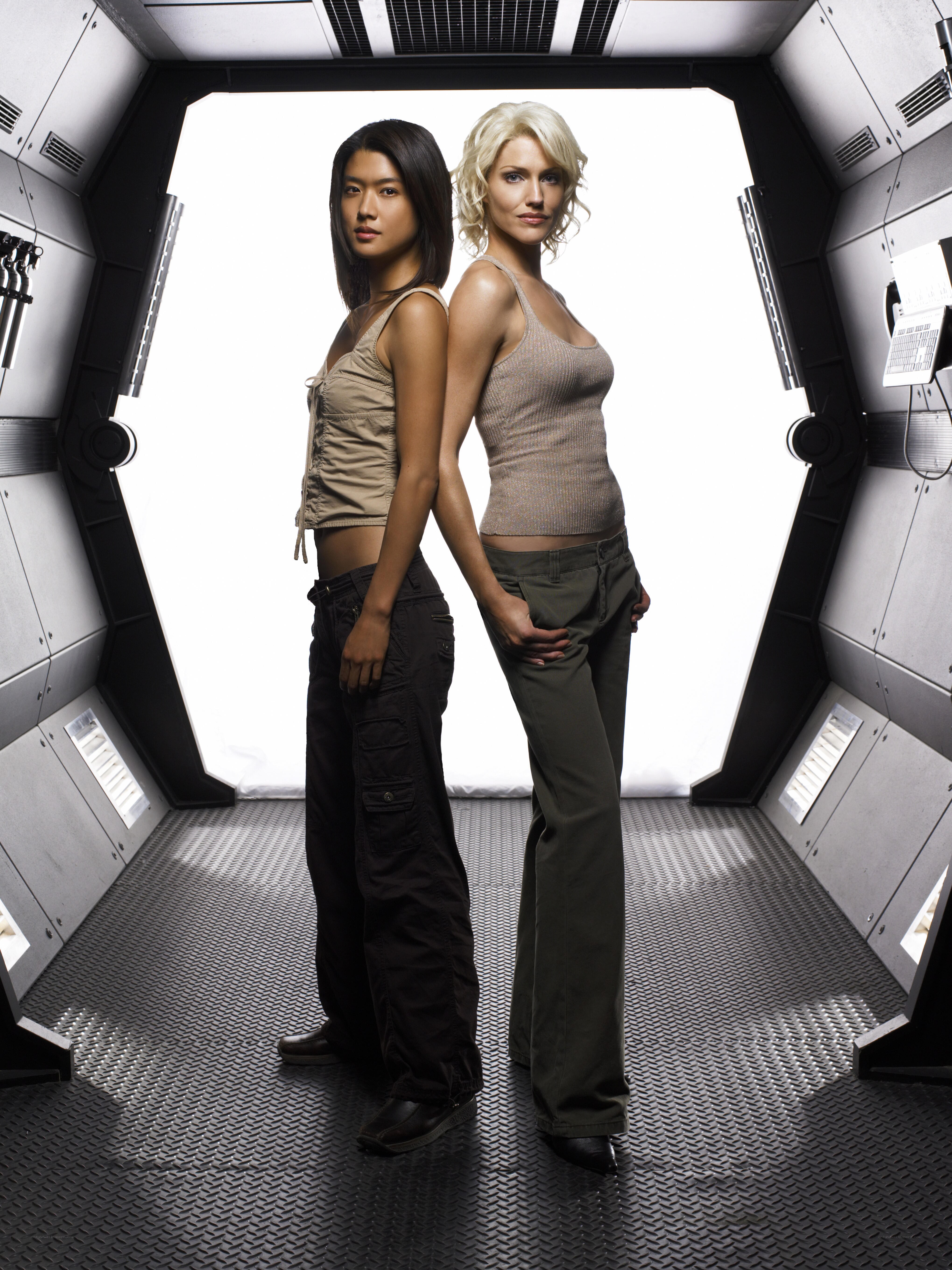 two women in futuristic corridor