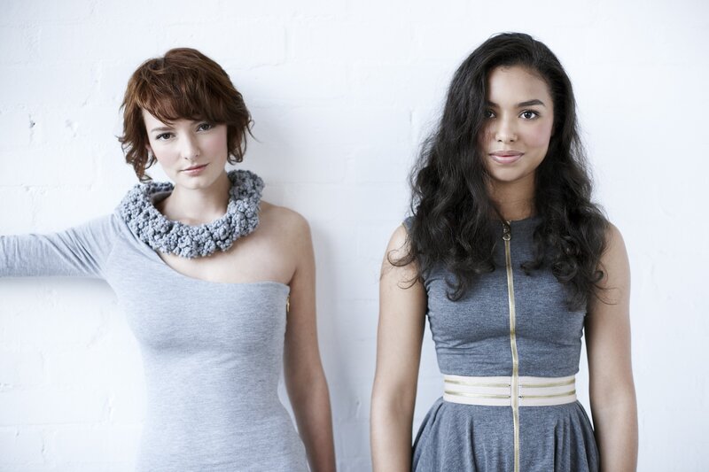 Two women in gray dresses