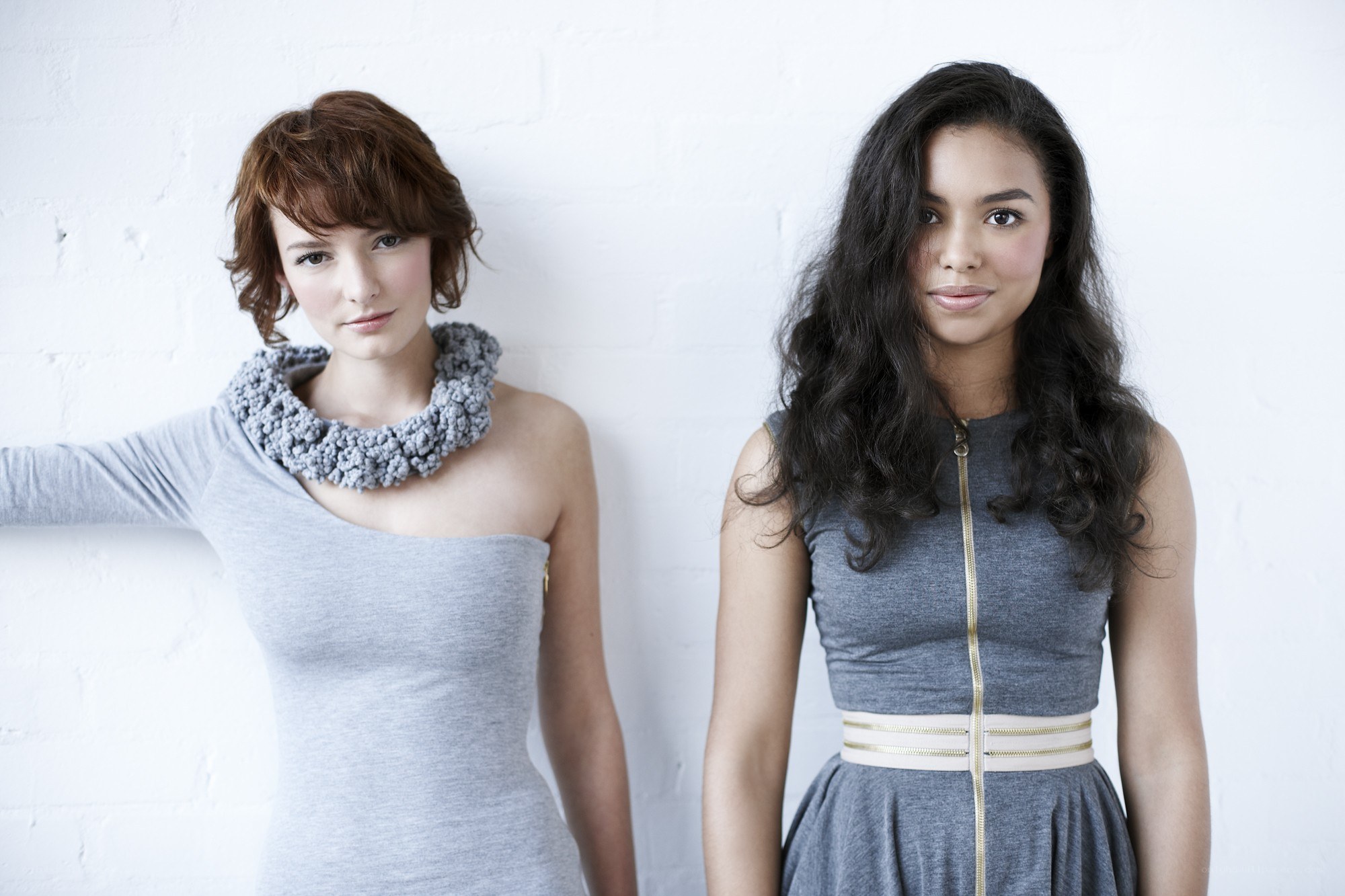 Two women in gray dresses