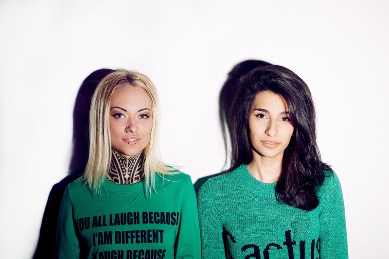 Two Women in Green Sweaters