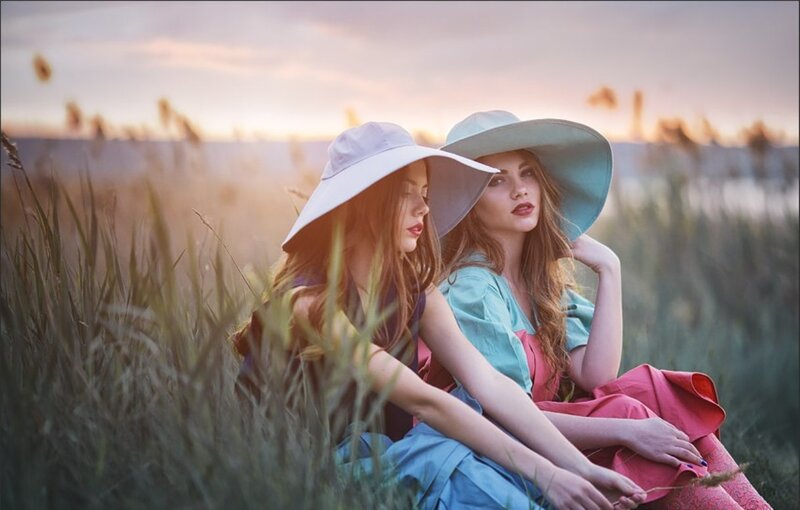 Two Women in Hats — Blue, Serene, Sunset, Photograph