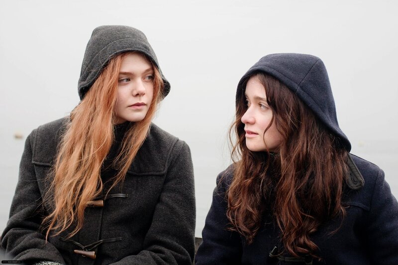 two women in hooded coats