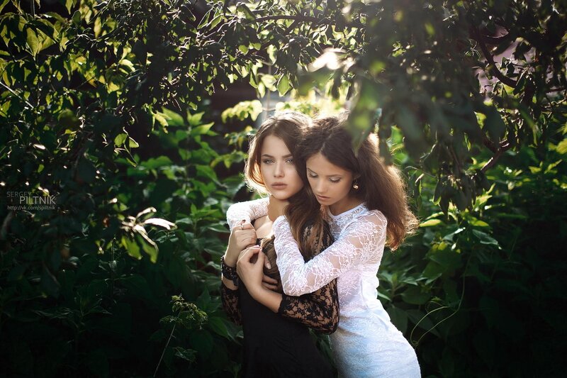 Two women in lace dresses