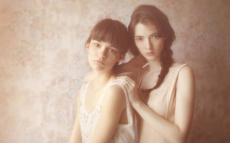 two women in lace dresses