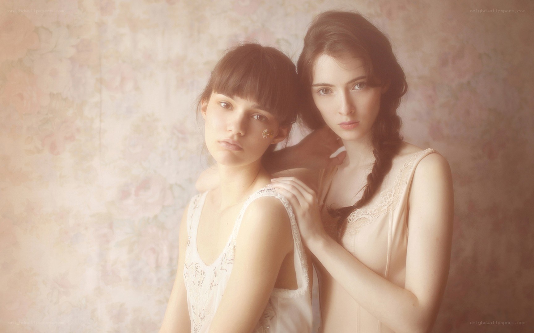 two women in lace dresses