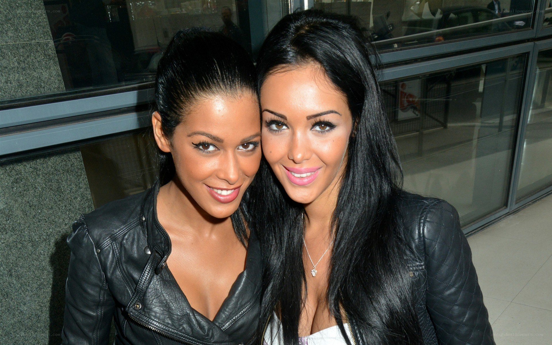 two women in leather jackets