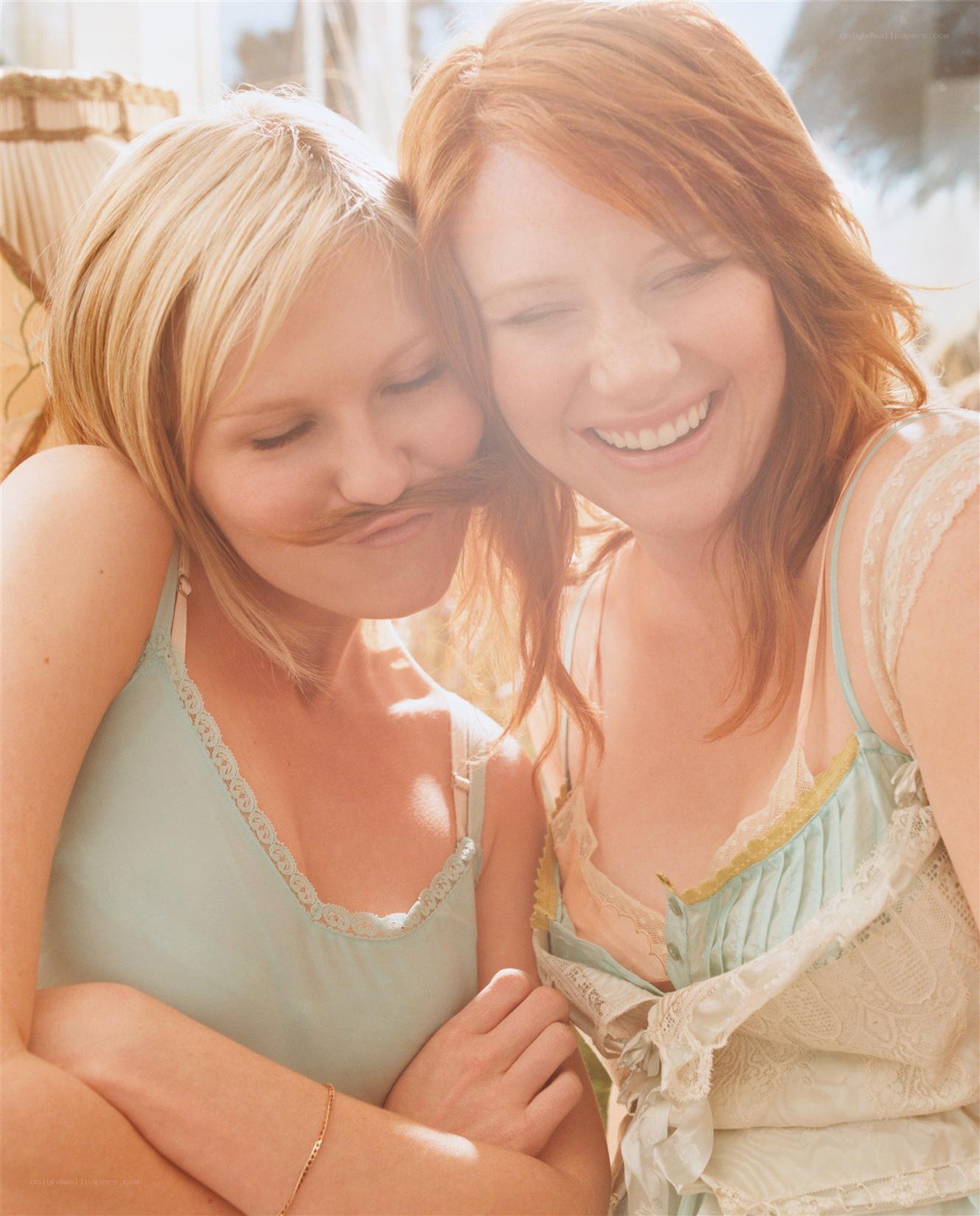 Two women in light tops