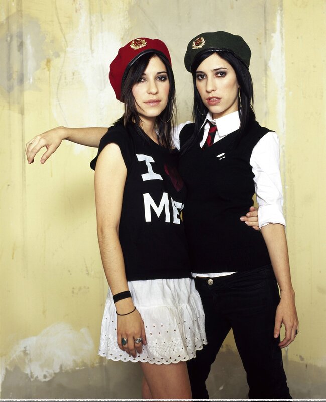 Two women in military-style hats