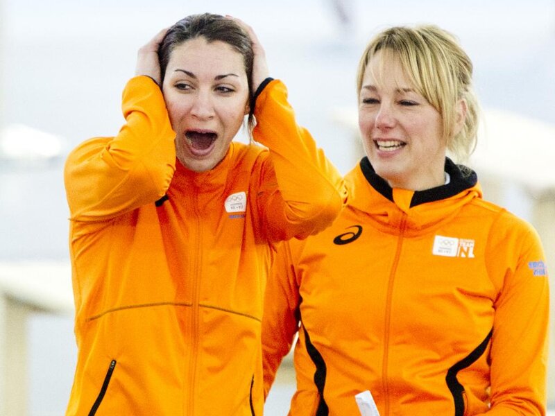 Two Women in Orange Jackets — Surprised