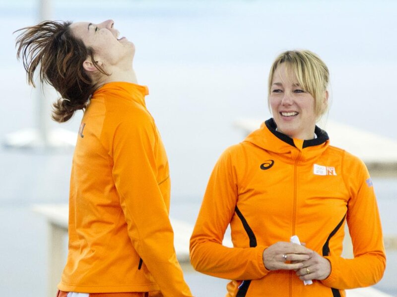 Two Women in Orange Jackets