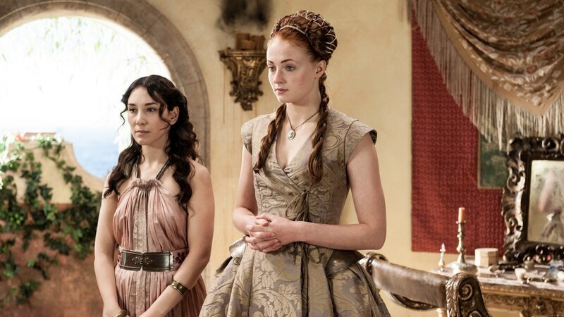 Two women in ornate dresses