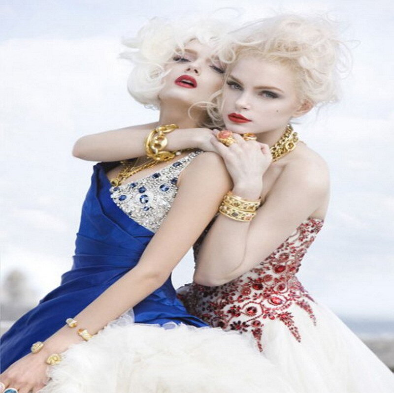 Two women in ornate gowns