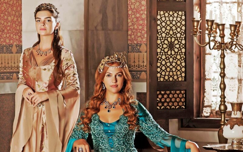Two women in ornate historical attire