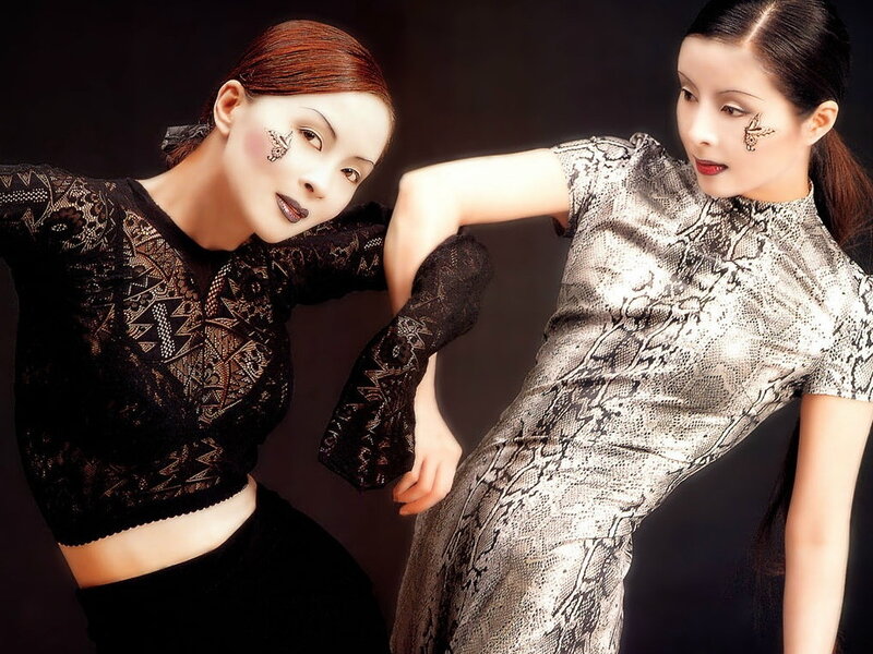 Two Women in Patterned Dresses — Black
