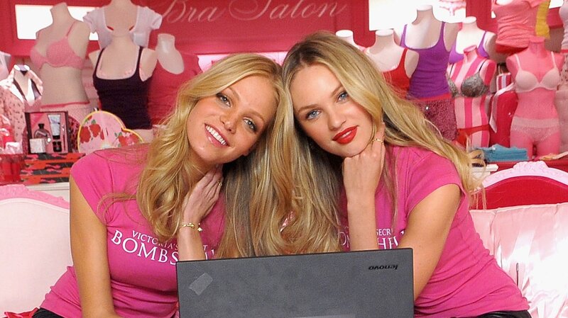 Two Women in Pink Shirts — Friendly, Photograph, Laptop
