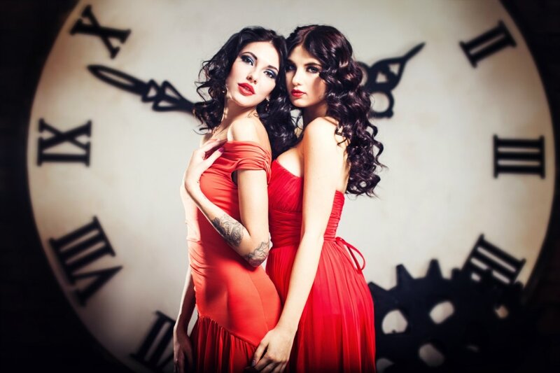 Two Women in Red Dresses — Dramatic, Photograph, Clock Face