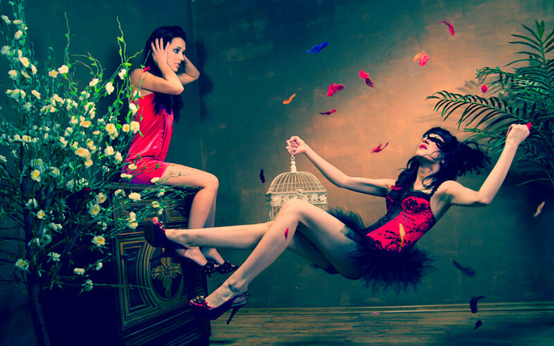 Two Women in Red Outfits — Dramatic, Photograph