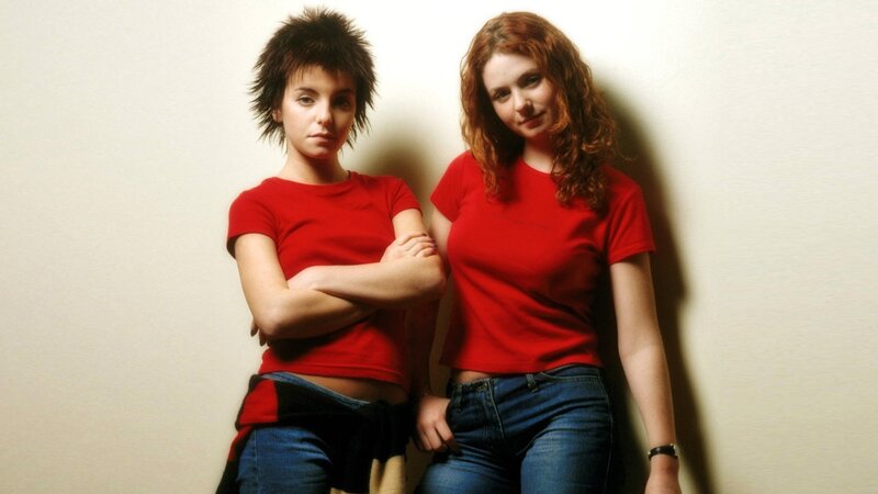 two women in red shirts