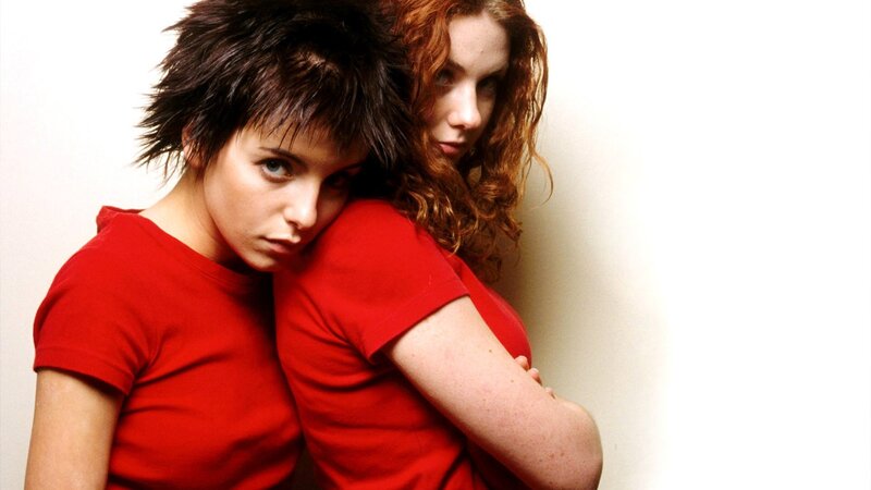 two women in red shirts