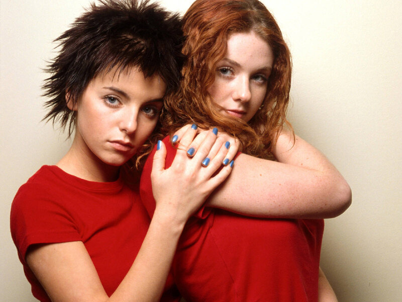 two women in red shirts