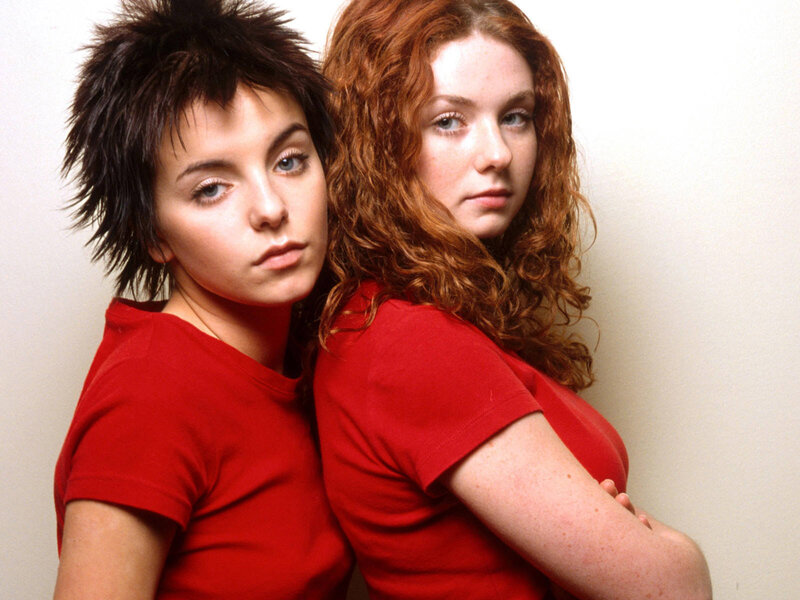 two women in red shirts