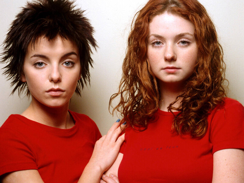 Two women in red shirts