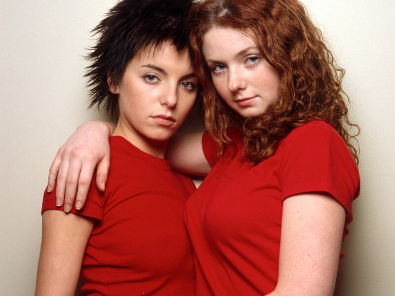 two women in red shirts