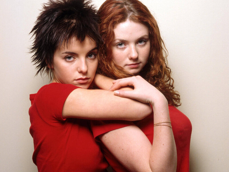two women in red shirts