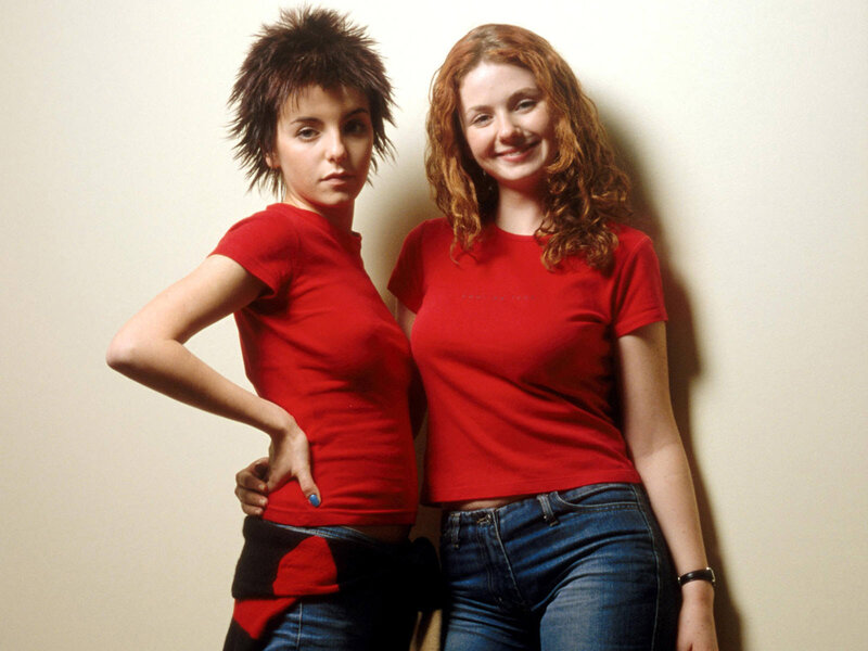 two women in red shirts