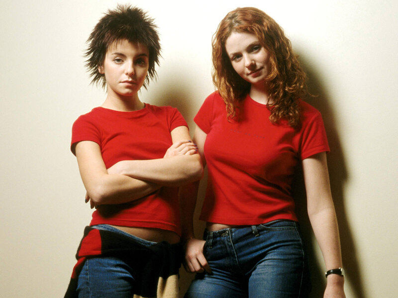 two women in red shirts