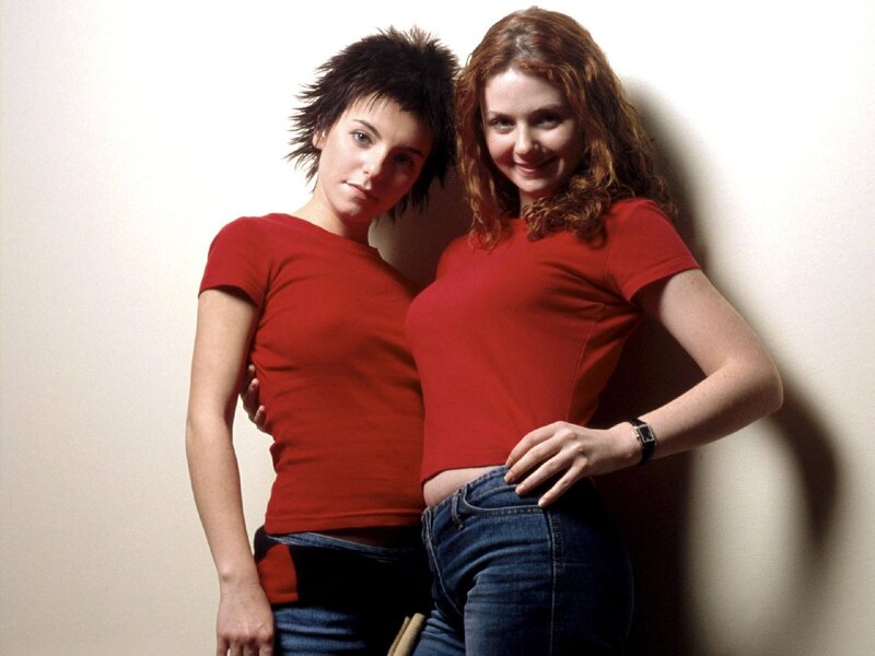two women in red shirts