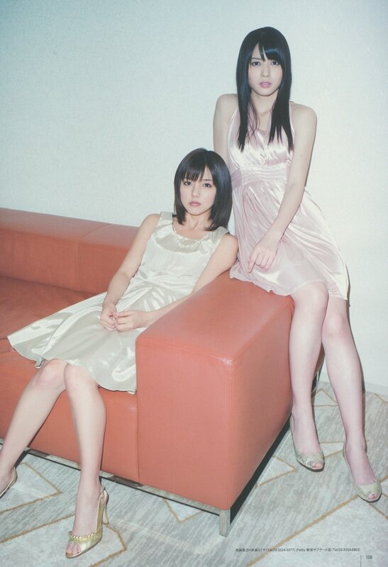 Two women in satin dresses