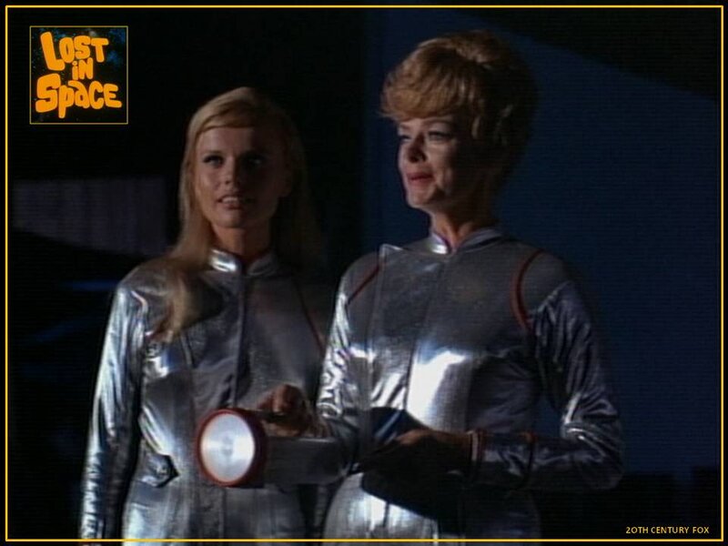 Two Women in Silver Suits