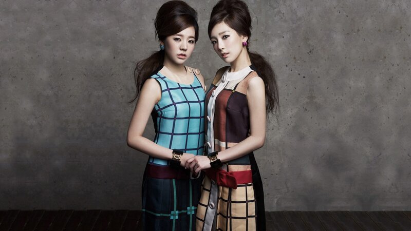 two women in stylish dresses