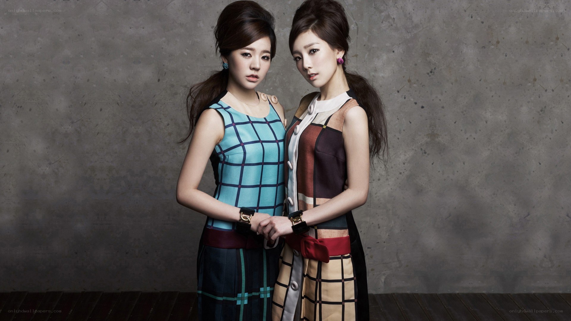 two women in stylish dresses