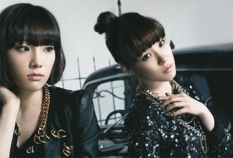 two women in stylish outfits