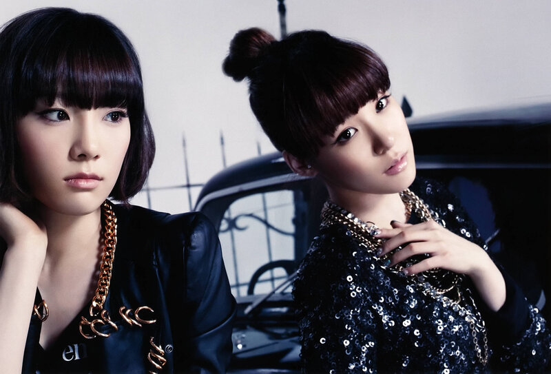 two women in stylish outfits