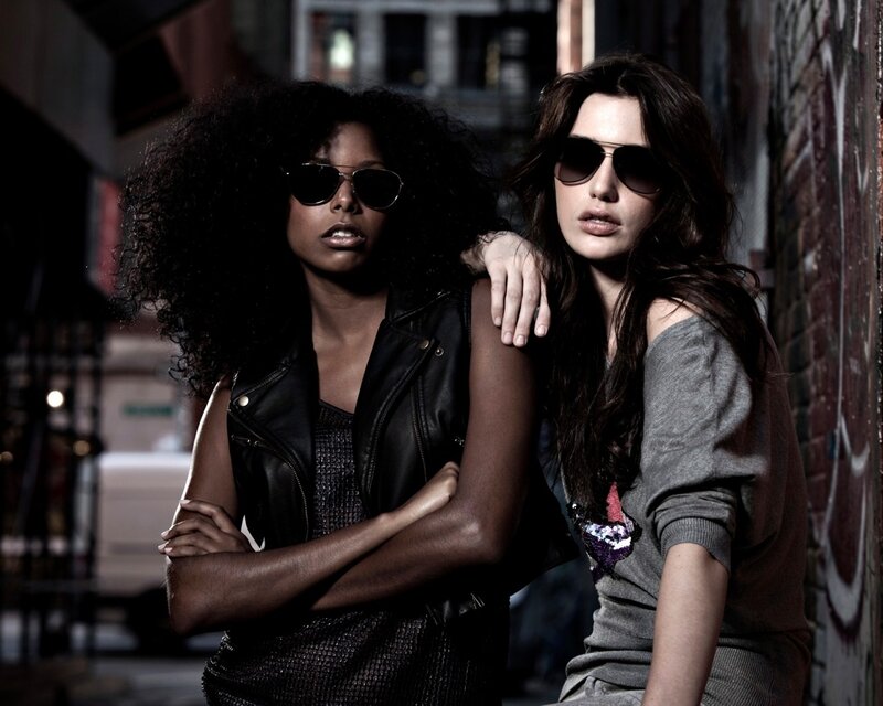 two women in sunglasses on street